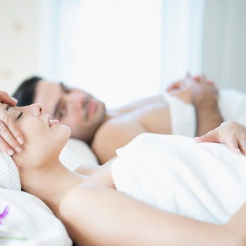 midsection-woman-lying-bed_1048944-22027229